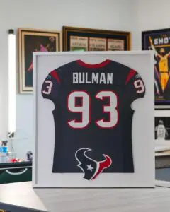 Houston Texans 93 Tim Bulman navy jersey framed with white mat and team logo
