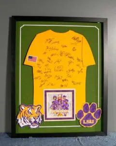 Signed yellow sports shirt professionally framed in a shadow box