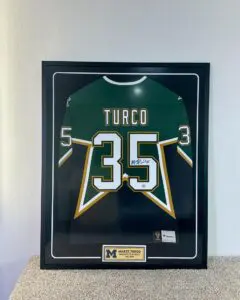 Framed Marty Turco signed University of Michigan hockey jersey with plaque