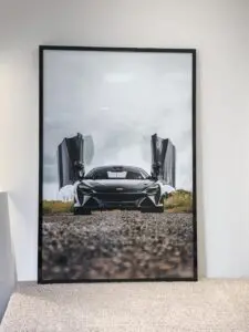 Framed photograph of a McLaren supercar with open butterfly doors