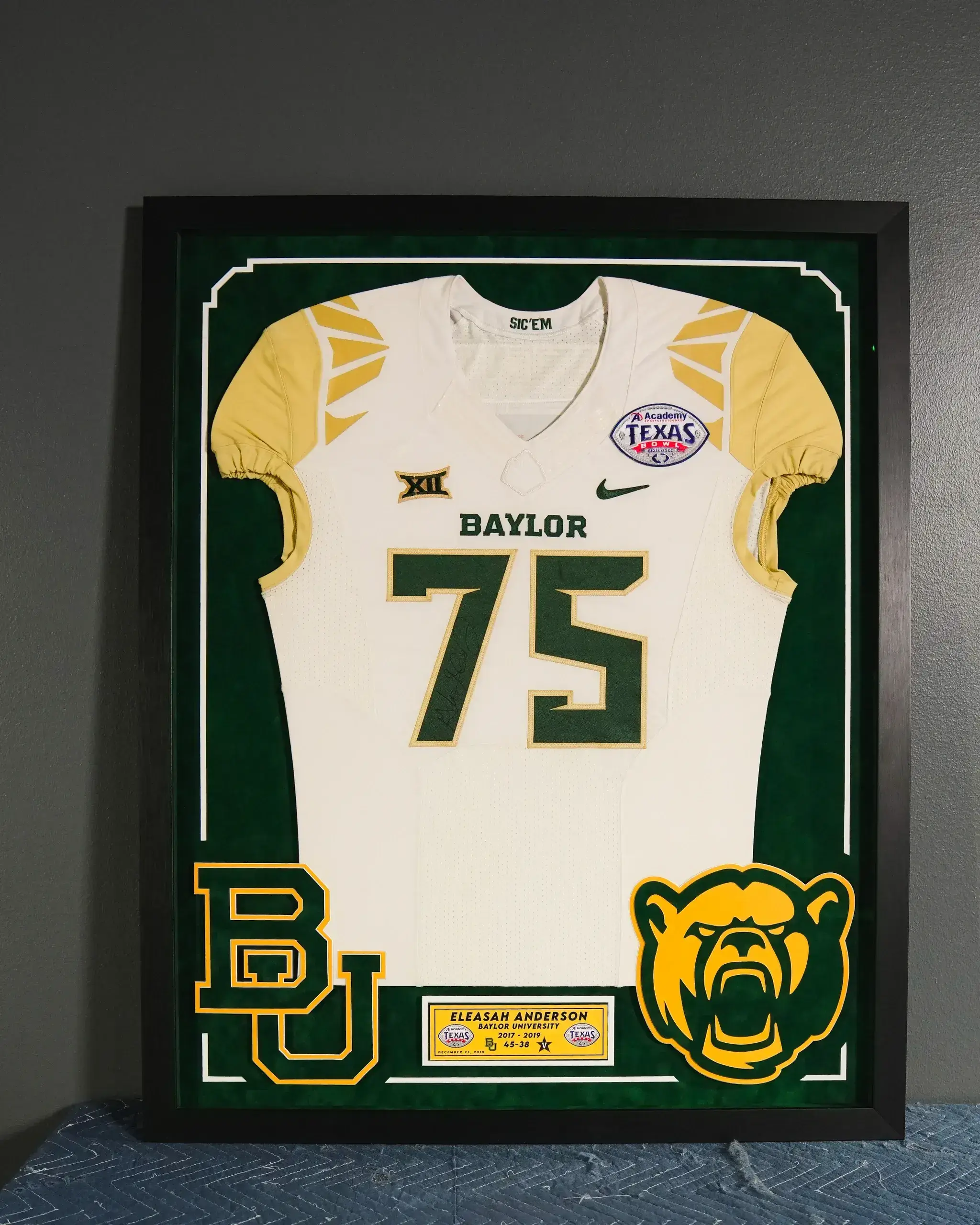 A framed jersey with baylor on it.