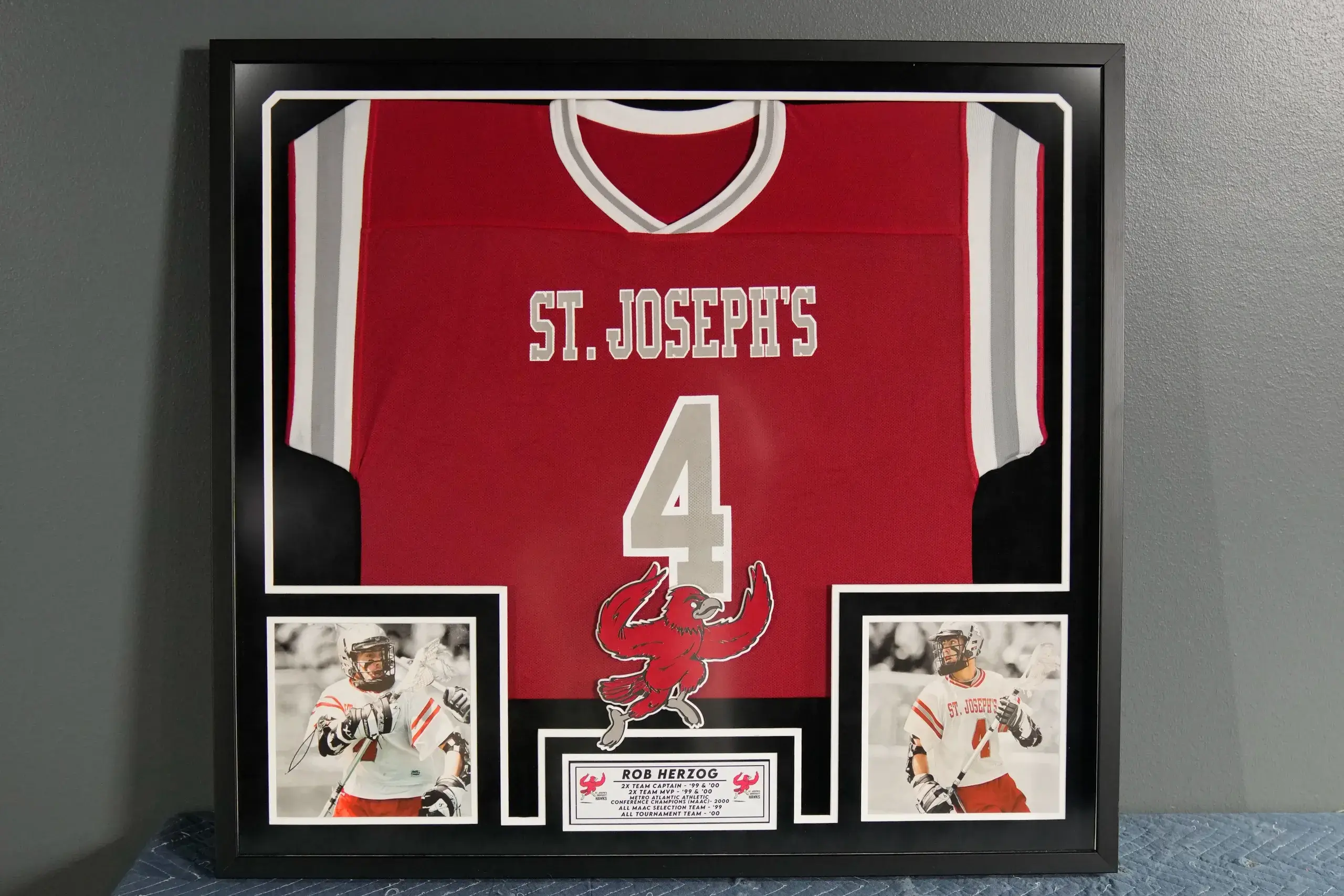 A framed jersey with two photos and a picture of the same person.