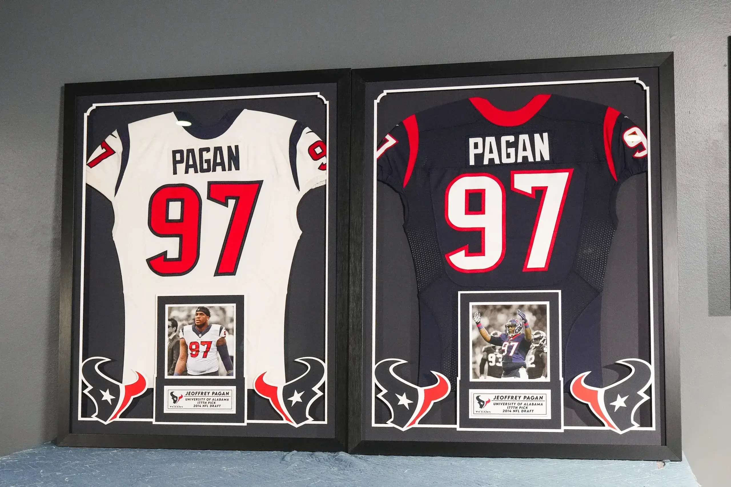 Two framed jerseys of a football player.