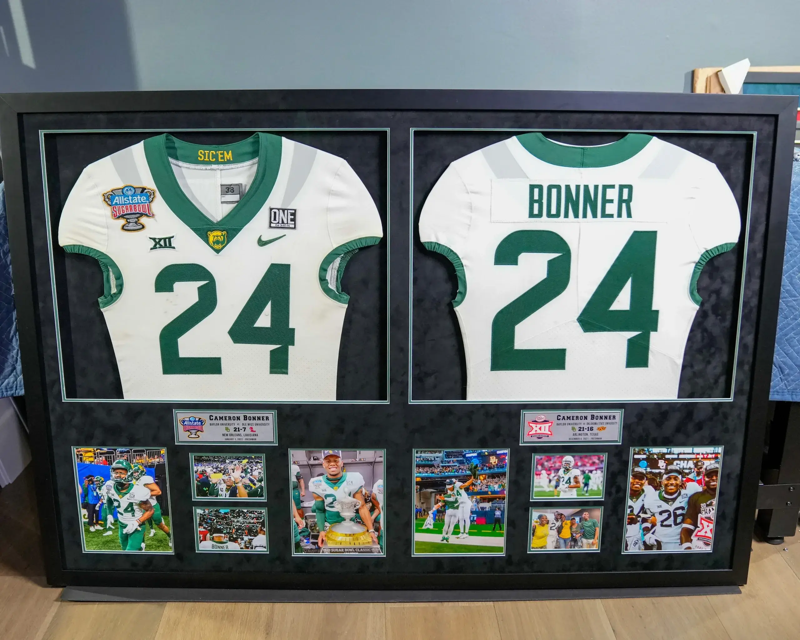 A framed jersey is shown with two different teams.