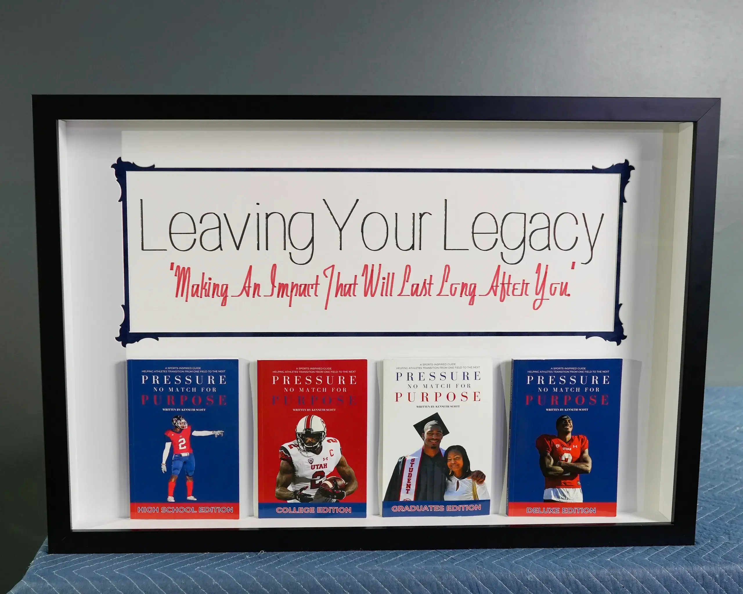 A framed book cover with four books on it.