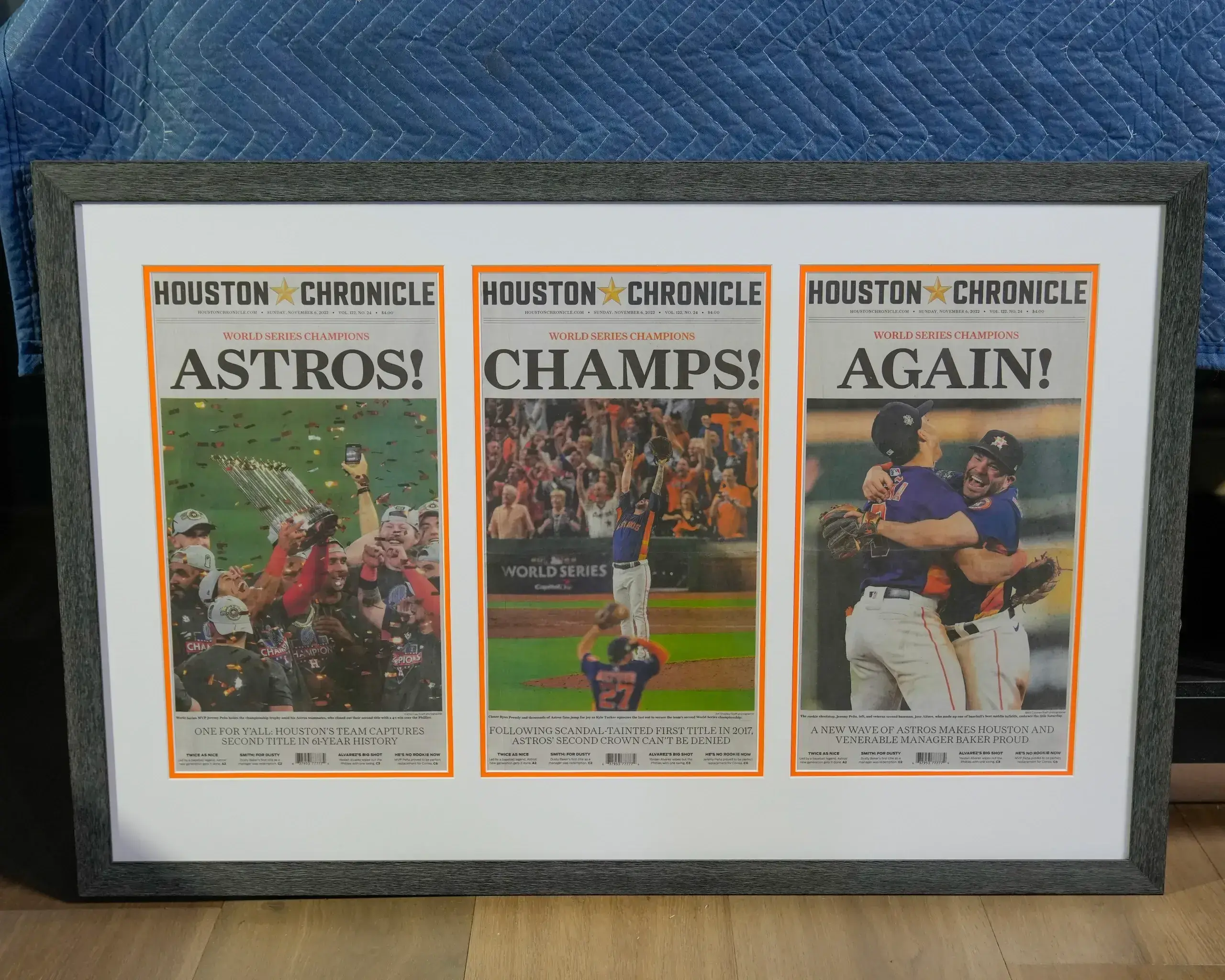 A framed houston chronicle astros baseball program.
