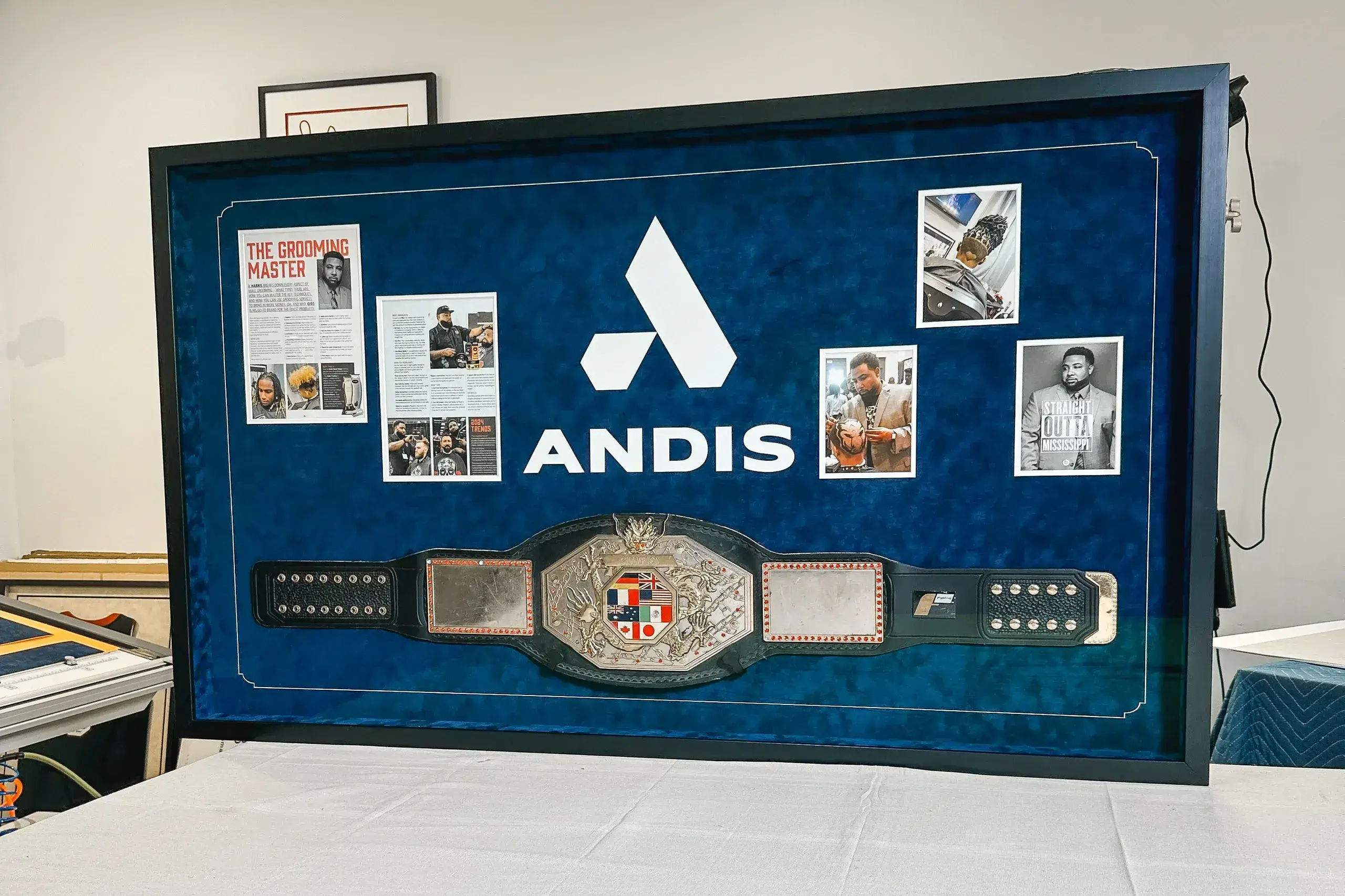 A blue case with a belt and pictures on it.