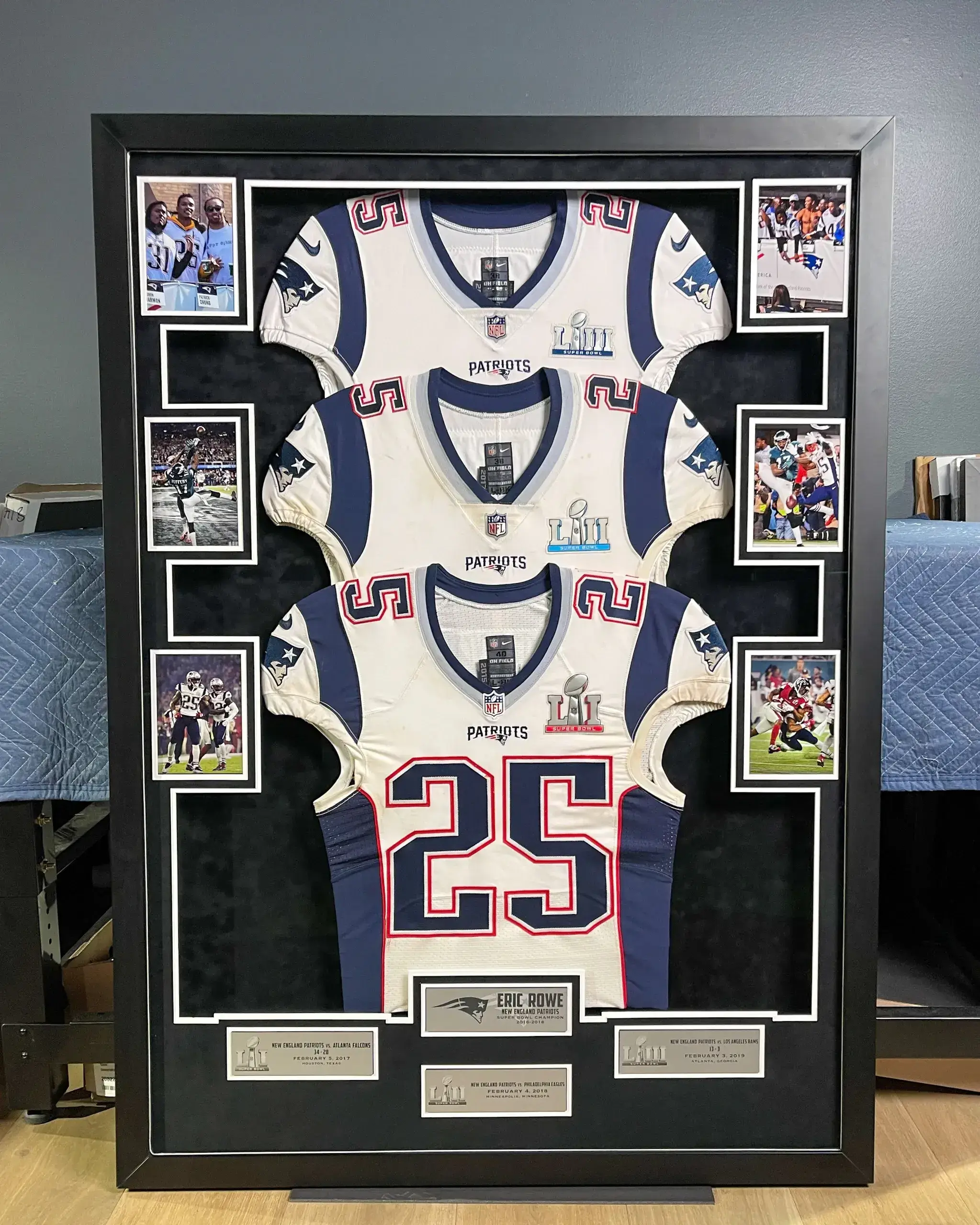 A framed jersey is displayed in the middle of a room.